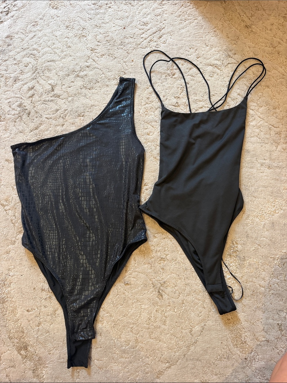 Two women’s body suits